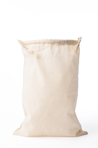 Opened cotton drawstring bag isolated on white background with clipping path.