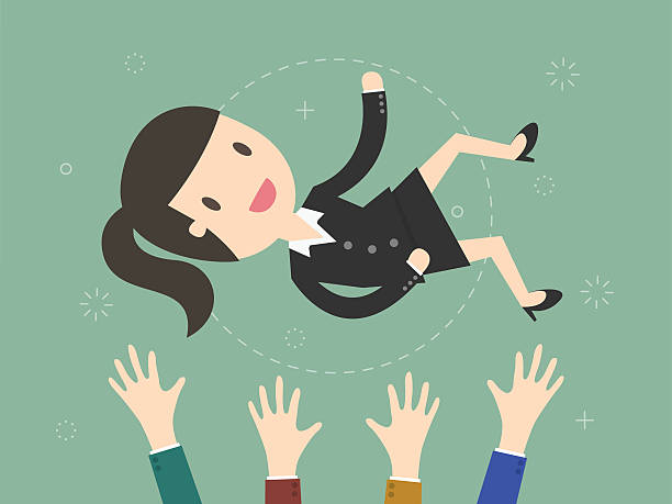 istock businesswoman being thrown in the air. 626368142