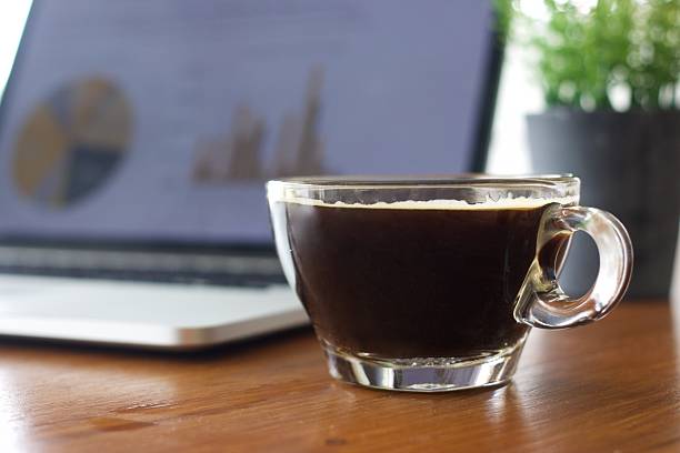 istock Laptop and coffee cup on old wooden table 626371138