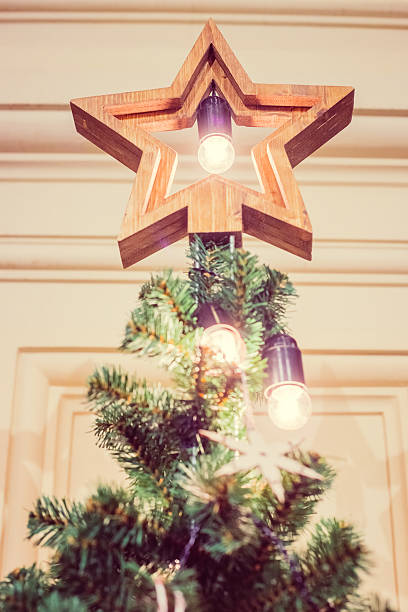 istock Wooden star in shining light as x'mas decoration. 626373196