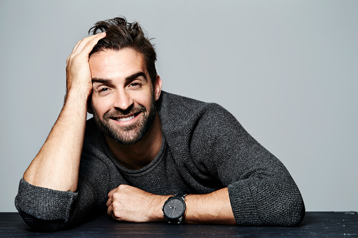 Smiling guy in grey sweater, portrait