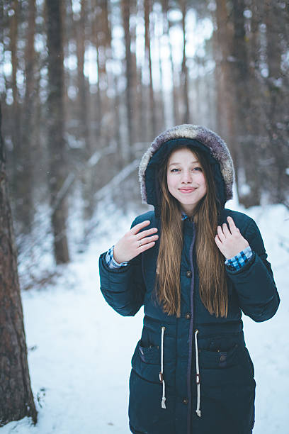istock Natural young woman in winter forest 626386094