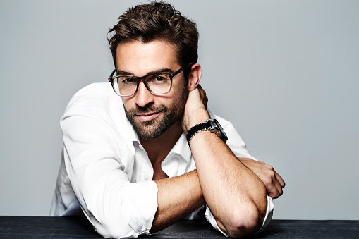 Spectacled and handsome in studio, portrait