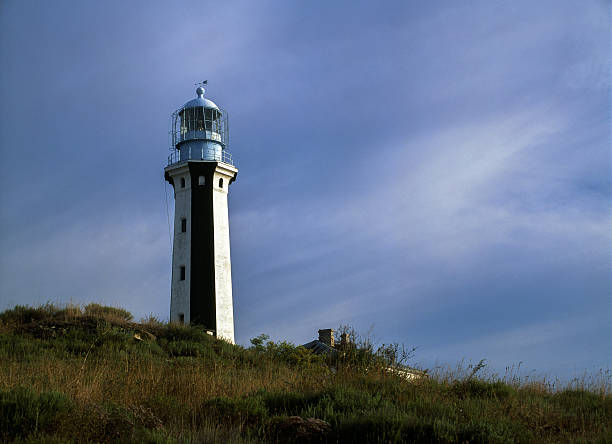 istock Lighthouse on the background of clouds. 626386226