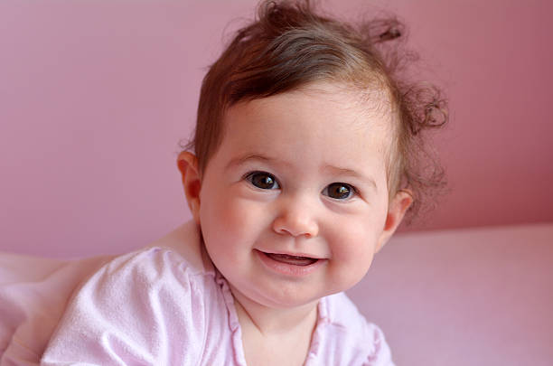 istock Happy baby smiles 626393718