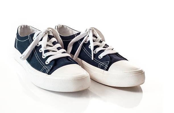 istock New blue sneakers on white background 626394708