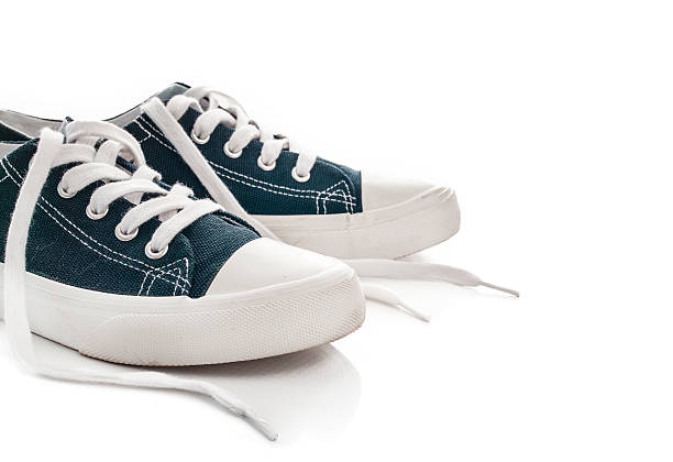 istock New blue sneakers on white background 626395008