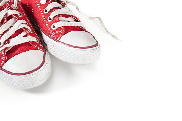 istock New red sneakers on white background 626395566