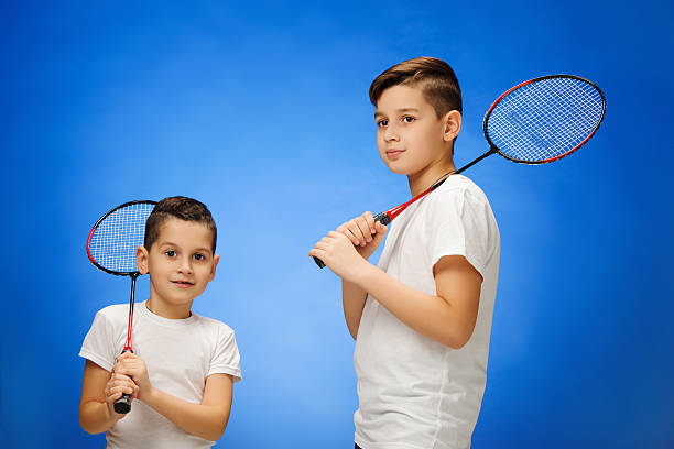 istock The two boys with  badminton rackets outdoors 626398628