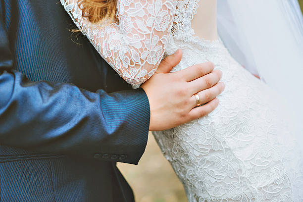 istock The groom embraces the bride 626399006