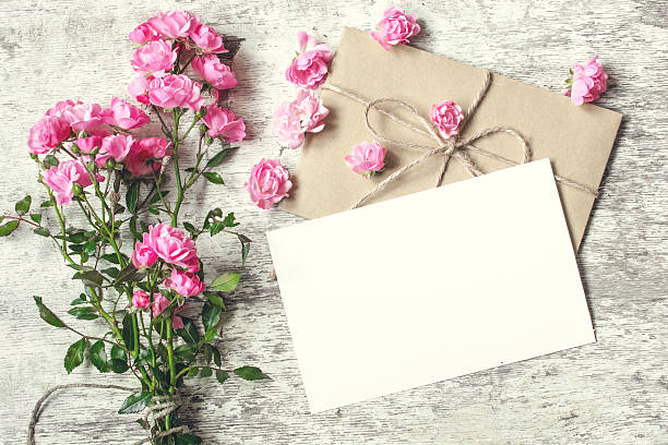 istock blank white greeting card with pink rose flowers. mock up 626401314