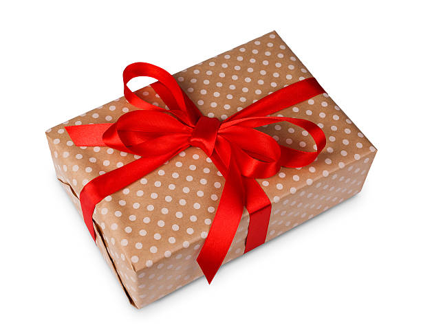 istock Christmas holiday gift box in spotted paper isolated on white 626403378