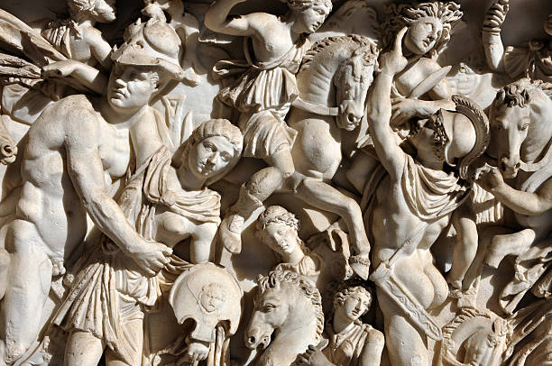 istock Bas-relief and sculpture of ancient Roman warriors 626408442