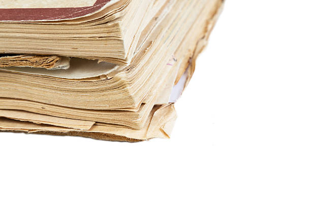istock Close up of old book pages background with copy space 626410614