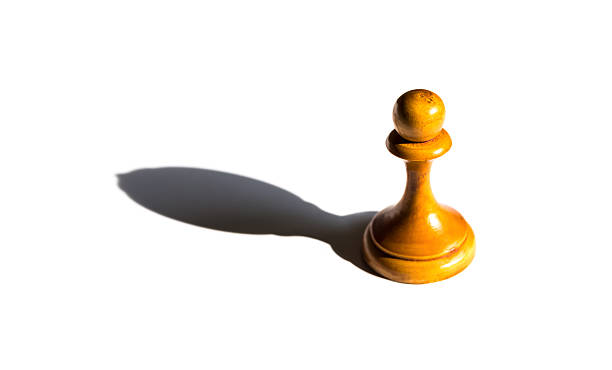 istock chess pawn casting a bishop piece shadow concept of strength 626410906