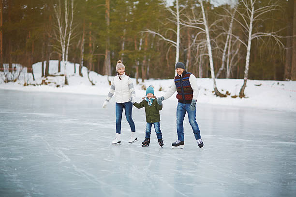 istock Family portrait on skating rink 626411764