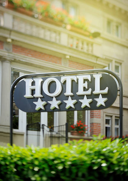 Detail of a luxury five stars hotel with beautiful building in the background on a beautiful sunny day. Tilt shift lens used to accent the word \