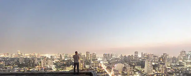 Photo of Man over top skyscraper
