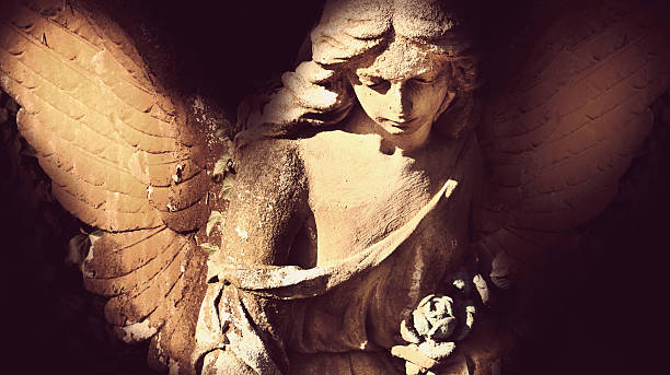 istock golden angel in the sunlight (antique statue) 626414410