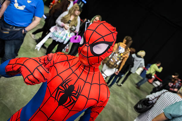 young cosplayer dressed as 'spiderman' - spider man stockfoto's en -beelden