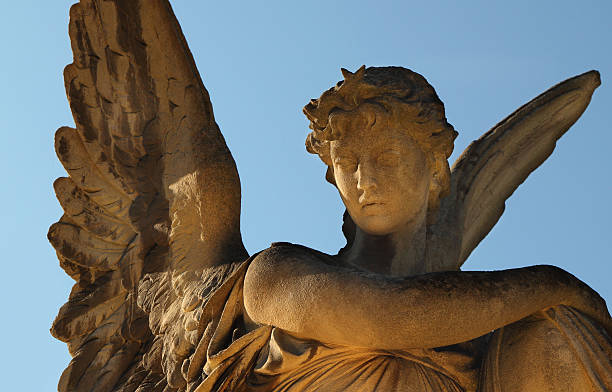 istock golden angel in the sunlight (antique statue) 626414586