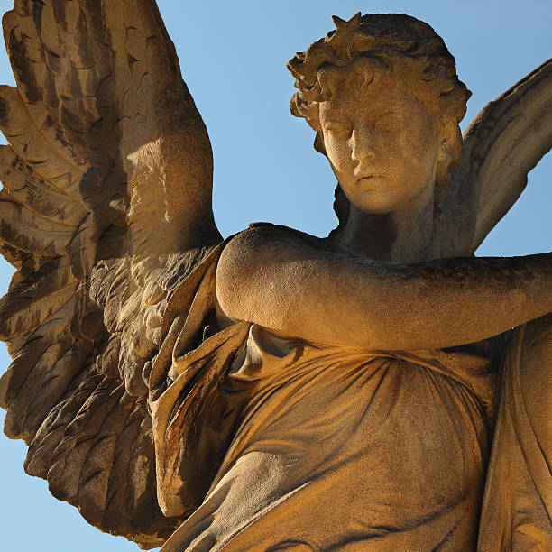 istock golden angel in the sunlight (antique statue) 626414630