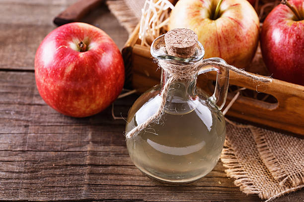 Bottle of unfiltered apple cider vinegar stock photo