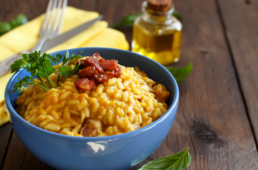 Risotto with a pumpkin and bacon close up