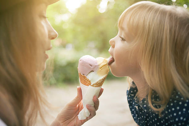 istock Mother and child eating ice cream 626416402