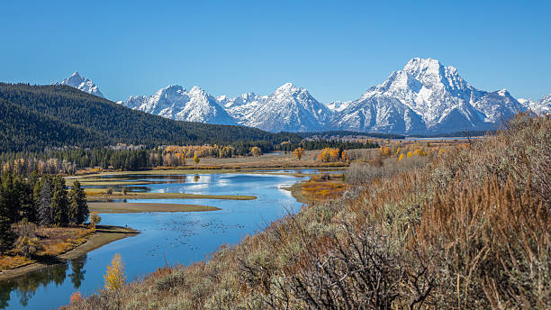istock Beautiful snow-capped mountains. Golden autumn. 626416530