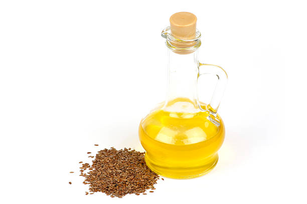 istock Linseed oil is poured into the bottle 626422036
