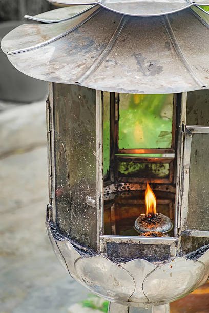 istock Vintage oil lantern lamp burning with glow light 626424602