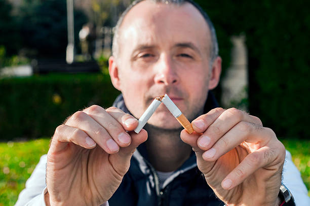 istock Gesture for quit smoking, Anti Smoking,  male hand crushing cigarette 626424852