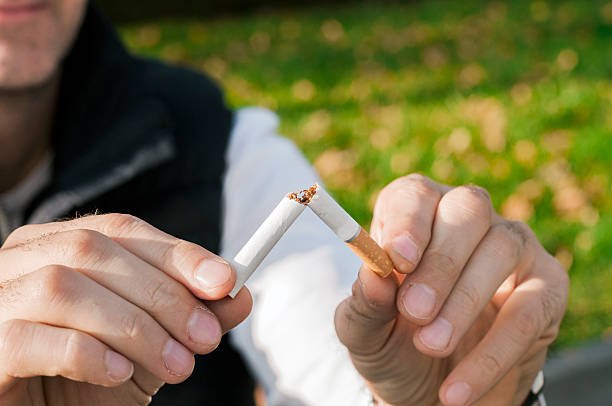 istock Gesture for quit smoking, Anti Smoking,  male hand crushing cigarette 626425178