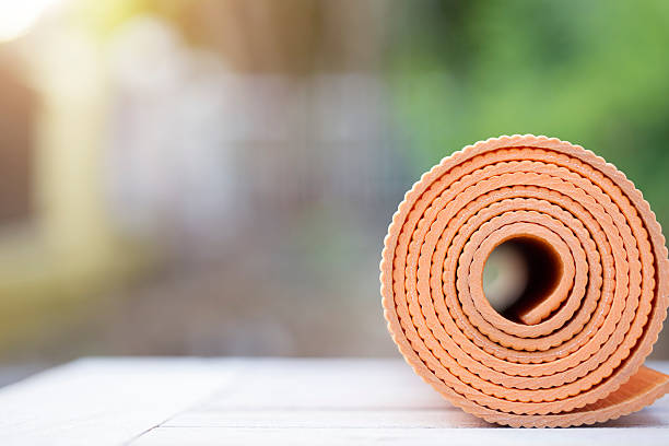istock yoga mat on the table in a garden 626426008