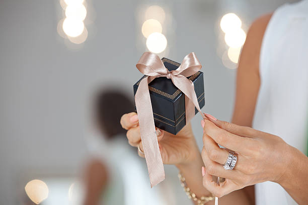 istock Female hands Giving a elegant gift 626426480