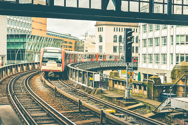 istock Train on elevated tracks coming to the station in Hamburg 626426556