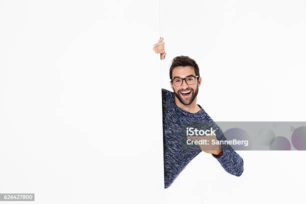 Happy Guy Points Stock Photo - Download Image Now - Eyeglasses, Pointing, People