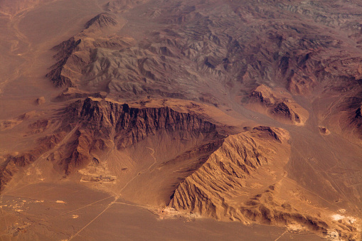 Mountains in the desert, aerial view. Shallow DOF - focus on the mountains range