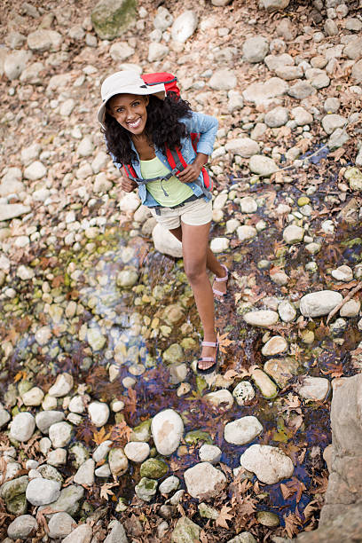 istock Backpacker woman enjoying nature. 626428734