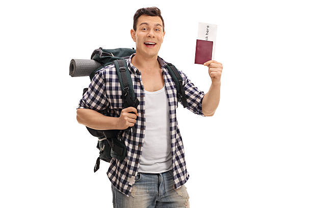istock Cheerful tourist holding a passport 626429622