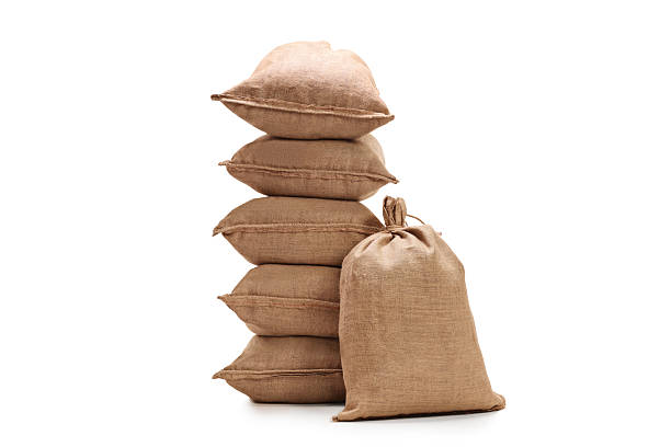 Burlap sacks Burlap sacks isolated on white background cement bag stock pictures, royalty-free photos & images