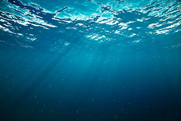3d rendering underwater with sunrays and in deep tropical sea