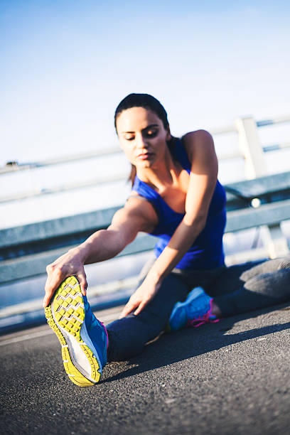 istock Young sportswoman stretching 626435072