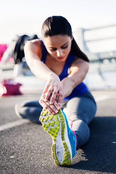 istock Young sportswoman stretching 626435282