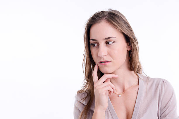 istock beautiful young woman model face portrait posing emotion white background 626436556