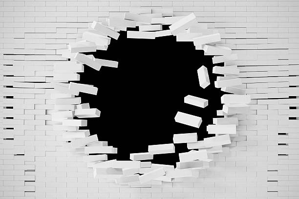 istock Destruction of a white brick wall for pasting anything text 626438802