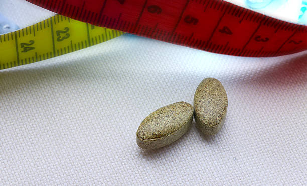 istock Weight loss pills.Closeup 626439396