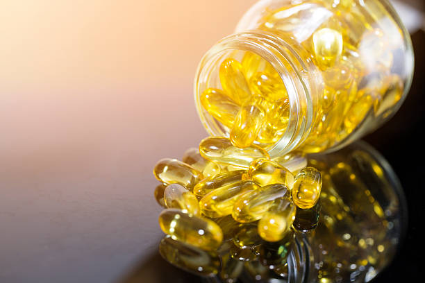 fish oil on the black table with sunlight