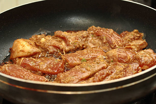 istock Cooking grilled pork with mixed herb served.  Selective focus. 626443168